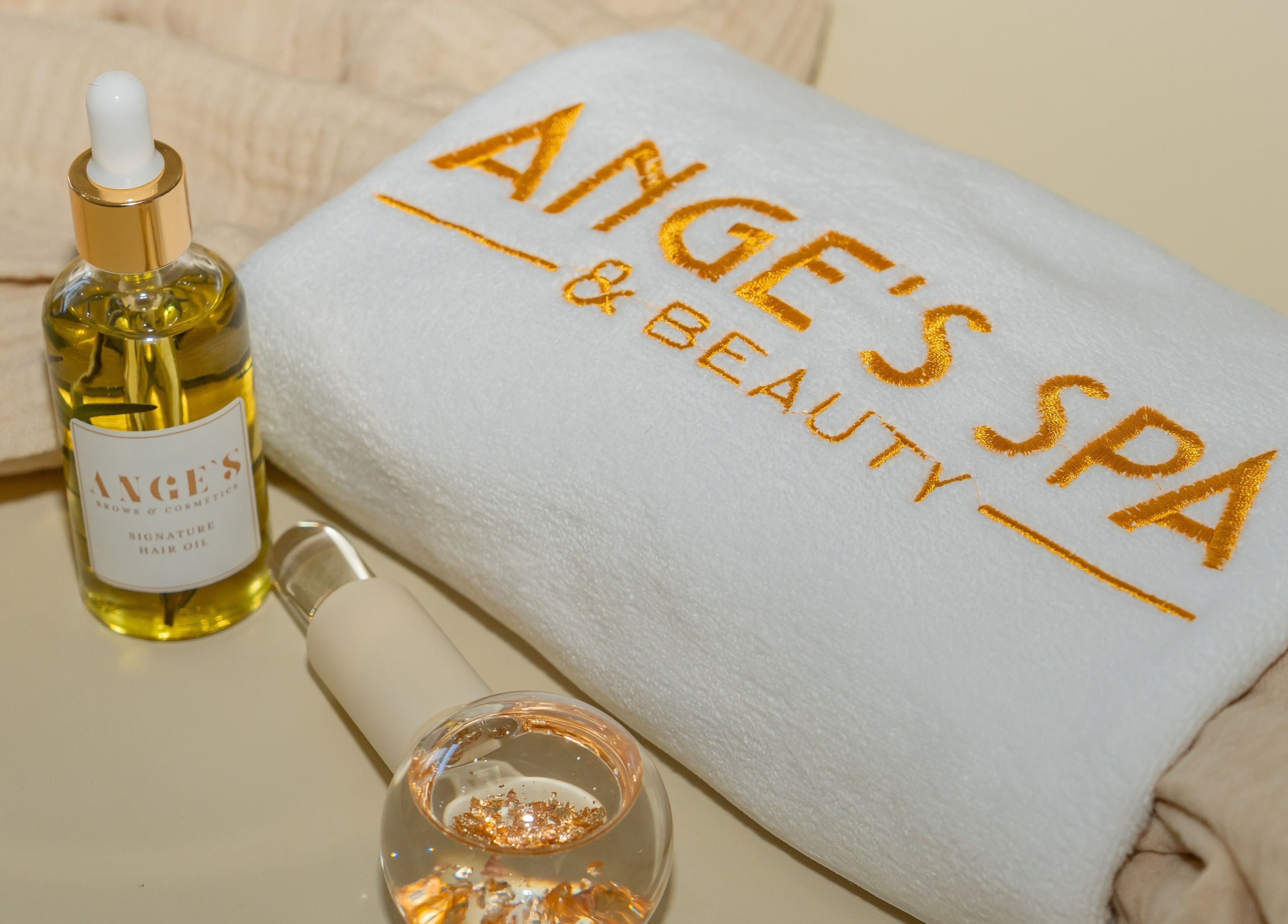 Luxury spa towel and hair oil at Ange's Spa and Beauty, Southampton, England, GB for ultimate relaxation.
