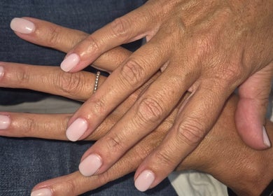 Freshly manicured hands at Beauty By Irena, Epsom, England, GB. Elegant pale pink nails.