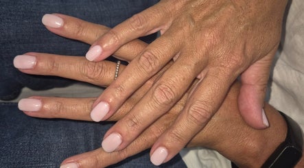 Freshly manicured hands at Beauty By Irena, Epsom, England, GB. Elegant pale pink nails.