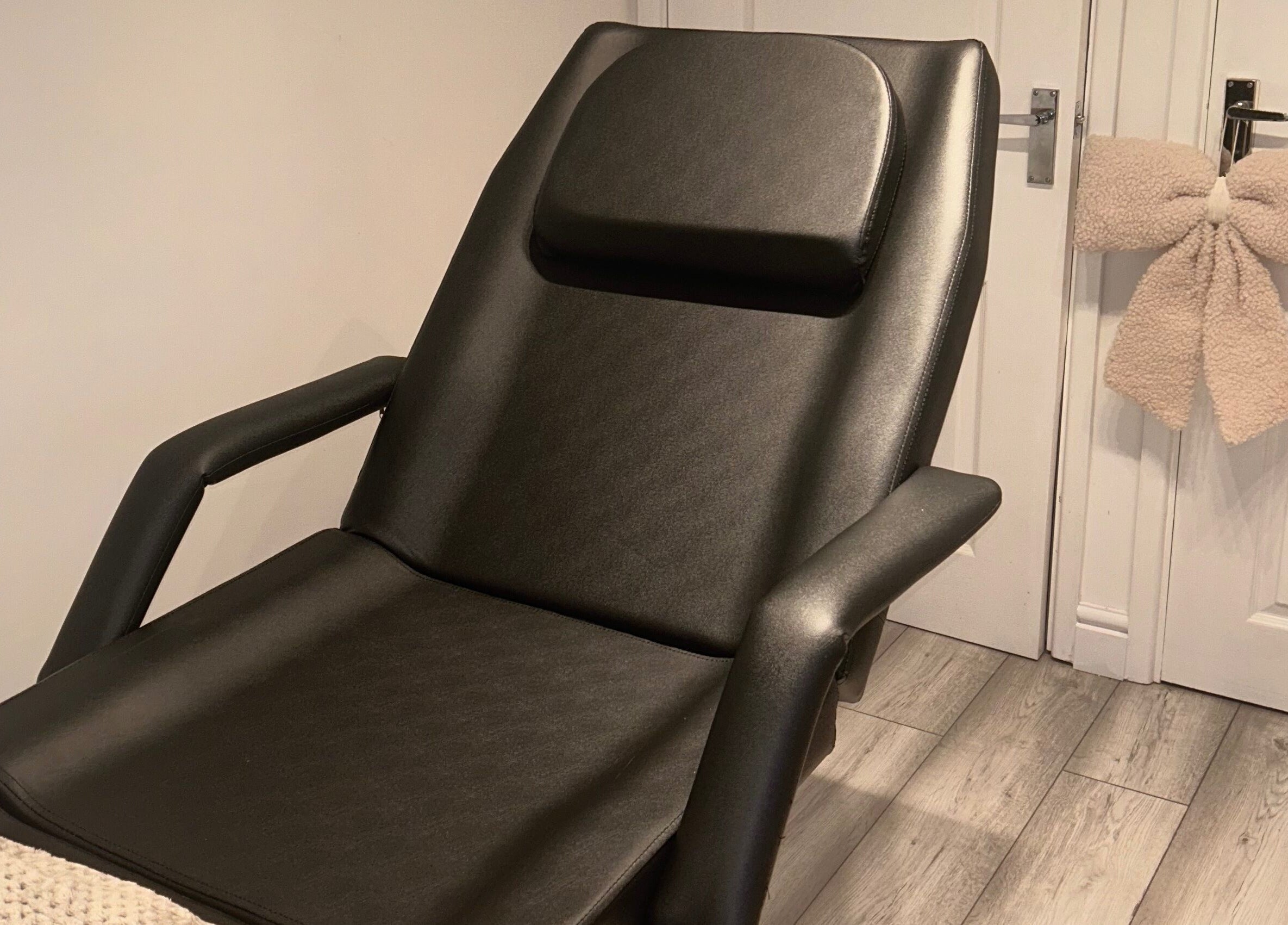 Relaxing black salon chair at Studio by Mimi, Bedford, England, GB, offering a calming beauty experience.