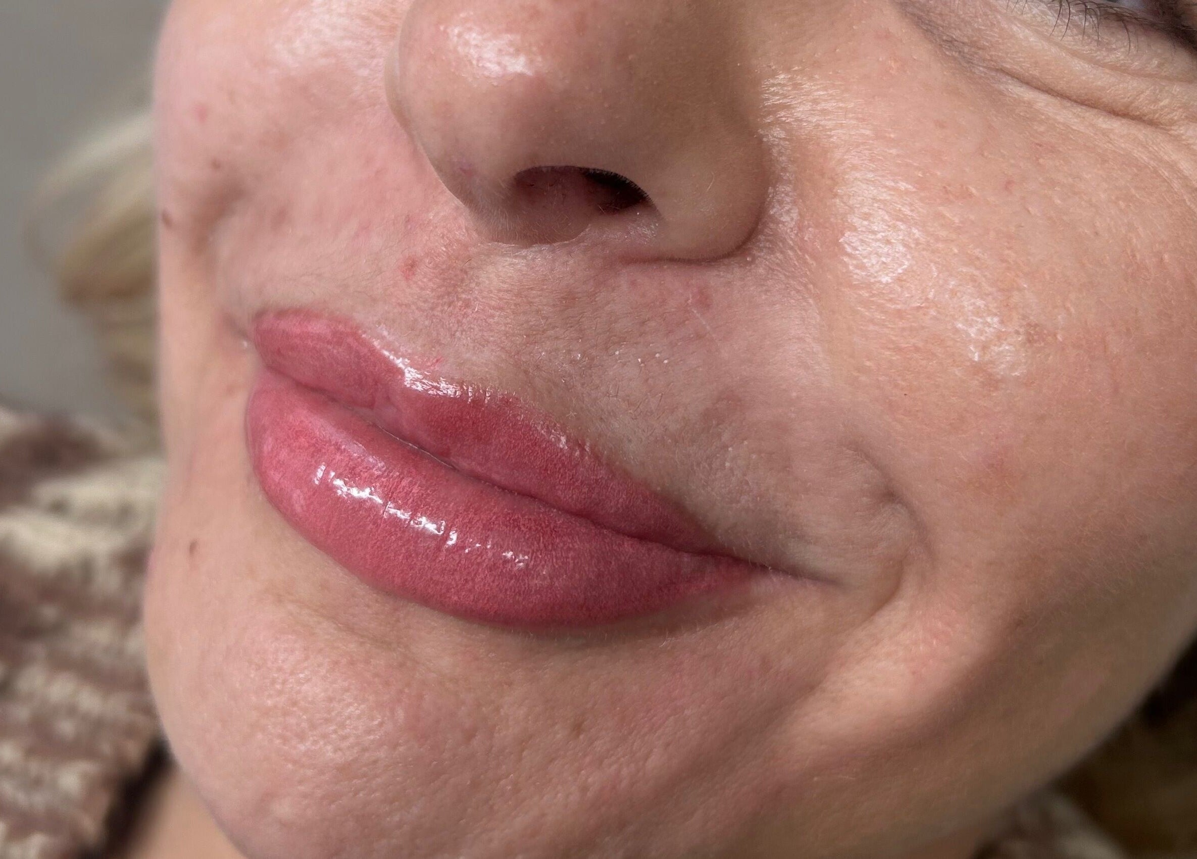 Close-up of shiny lips after beauty treatment at Studio by Mimi, Bedford, England, GB.