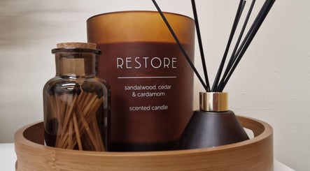 Aromatic restoration setup at Revive Sports Therapy And Massage, York, England, GB with candle and diffusers.