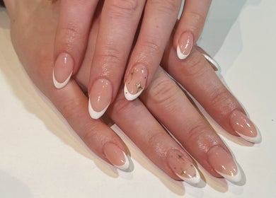 Stylish French manicure with gold accents at SV Beauty, Aberdeen, GB.