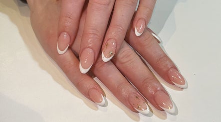 Stylish French manicure with gold accents at SV Beauty, Aberdeen, GB.