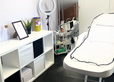 Cozy treatment room at AW House Of Aesthetics, Wick, England, GB. Features a comfortable chair and elegant decor.
