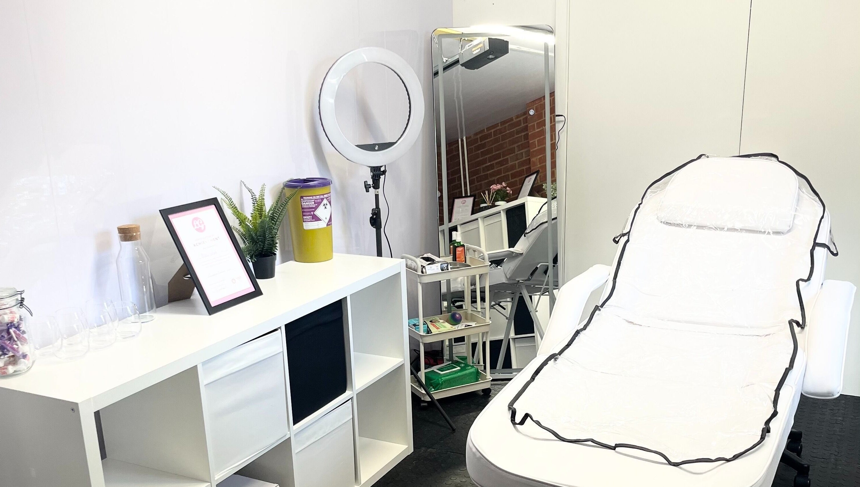 Treatment room at AW House Of Aesthetics, Wick, England, showing a spa chair and modern decor.