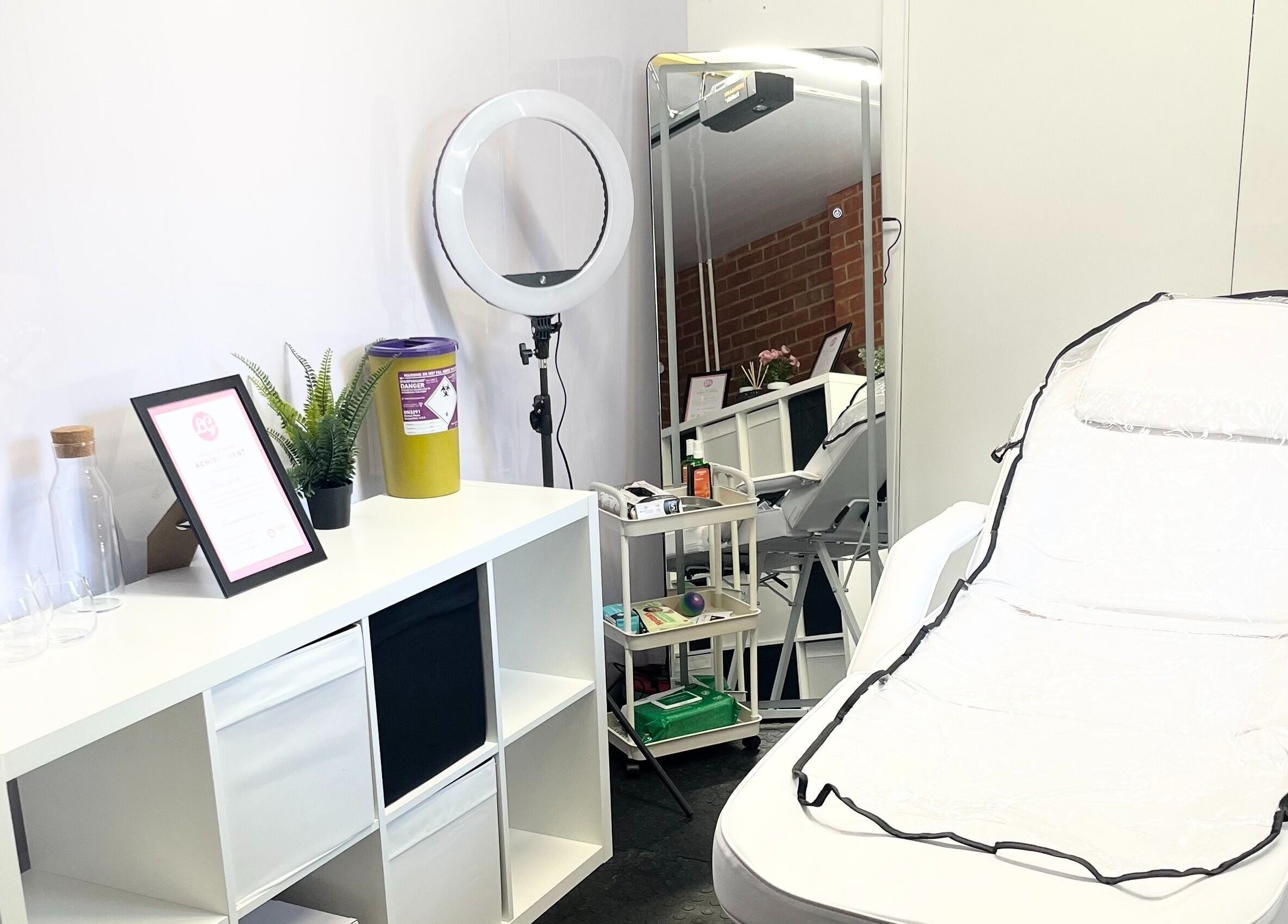 Treatment room at AW House Of Aesthetics, Wick, England, showing a spa chair and modern decor.