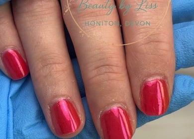 Bright red manicure at Be.You.Tiful beauty by Liss, Honiton, England, GB, showcasing expert nail care.