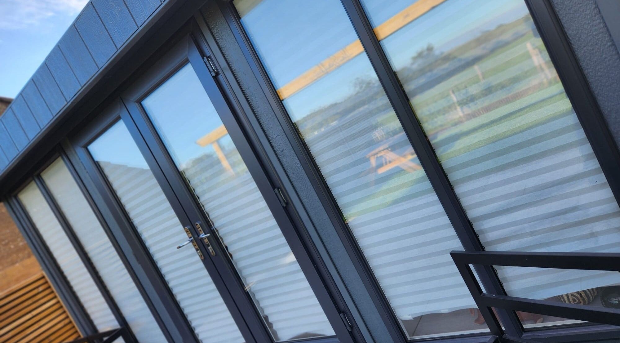 Modern glass facade of Dilecta Derma in Penrith, England, GB, highlighting sleek design.