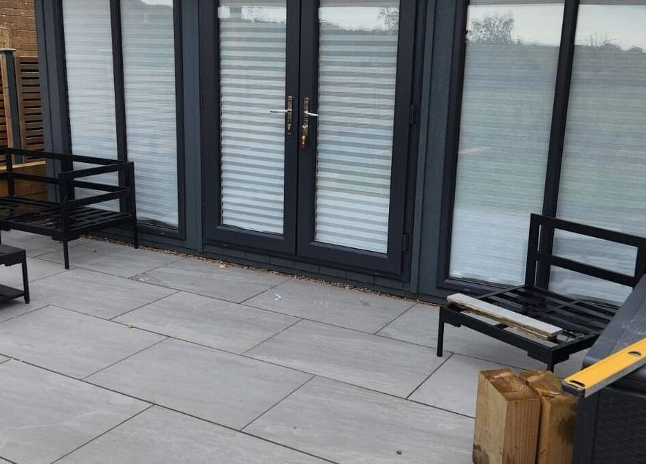 Modern patio seating at Dilecta Derma, Penrith, England, GB enhances relaxation in a serene outdoor setting.