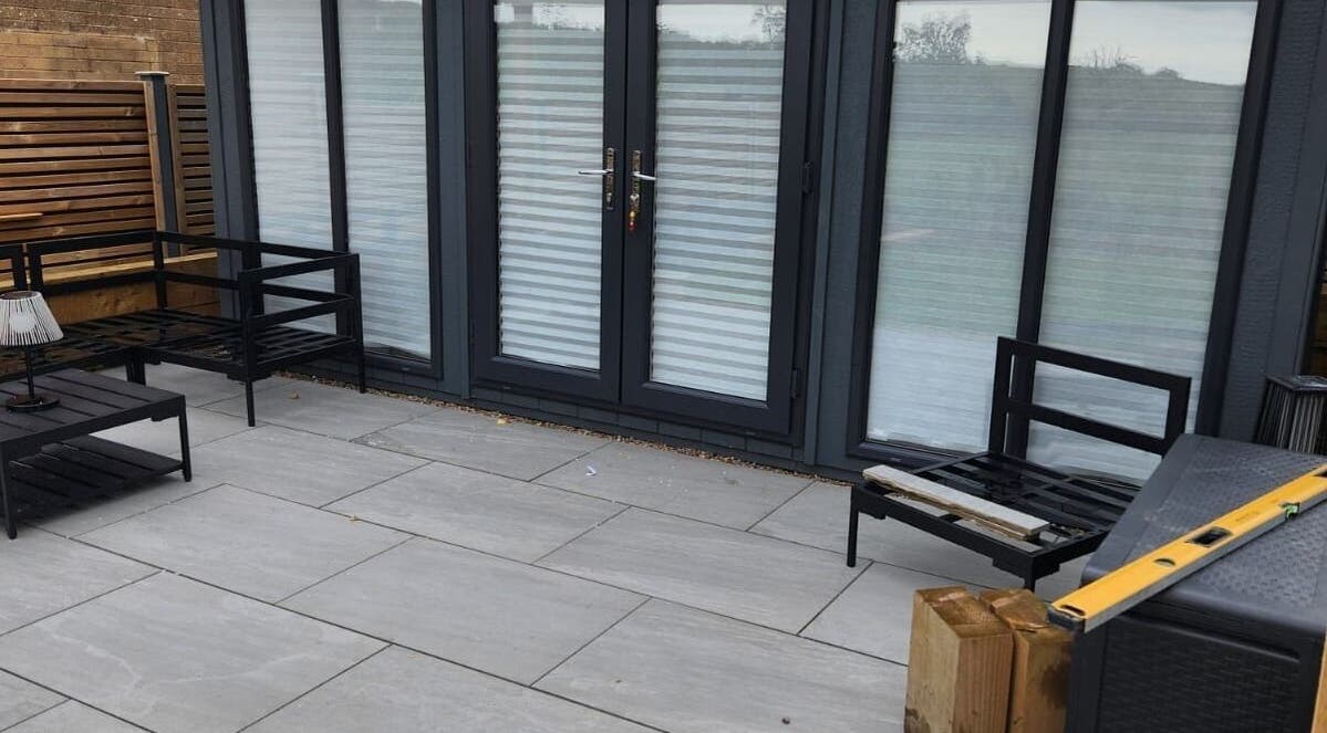 Modern patio seating at Dilecta Derma, Penrith, England, GB enhances relaxation in a serene outdoor setting.