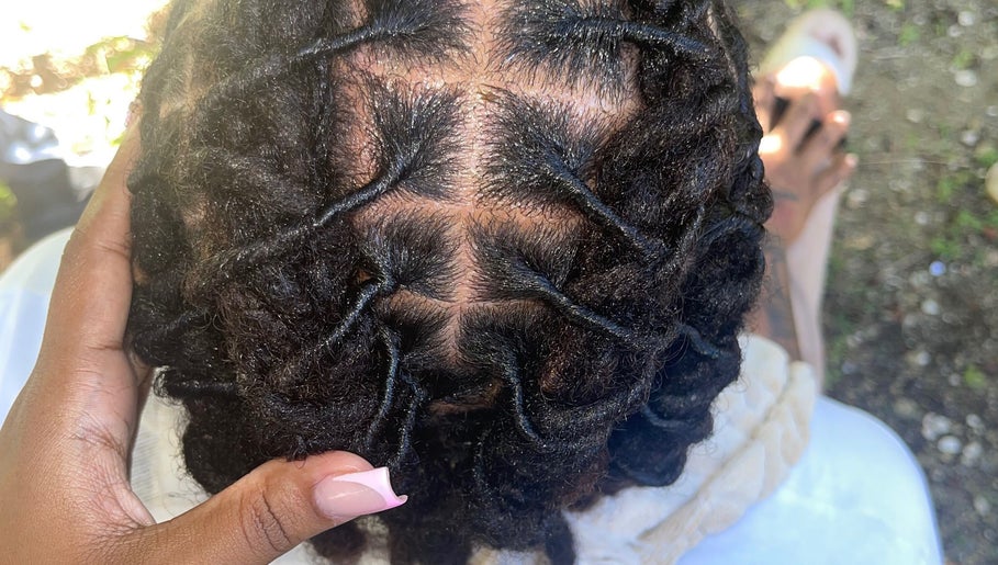 Intricate dreadlock style at Kurasao Hair, Willemstad, Curaçao, CW, showcasing expert braiding technique.