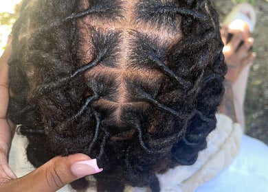 Intricate dreadlock style at Kurasao Hair, Willemstad, Curaçao, CW, showcasing expert braiding technique.