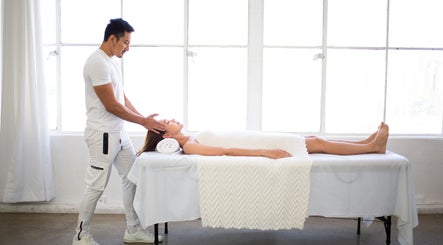 Calming massage session at MR WELLNESS In Motion, San Francisco, California, US. Tranquil and serene atmosphere.
