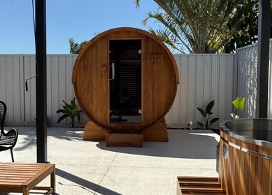 Relaxing barrel sauna at Rise and Fall Wellness, Kallaroo, Western Australia, AU, offering wellness retreats.