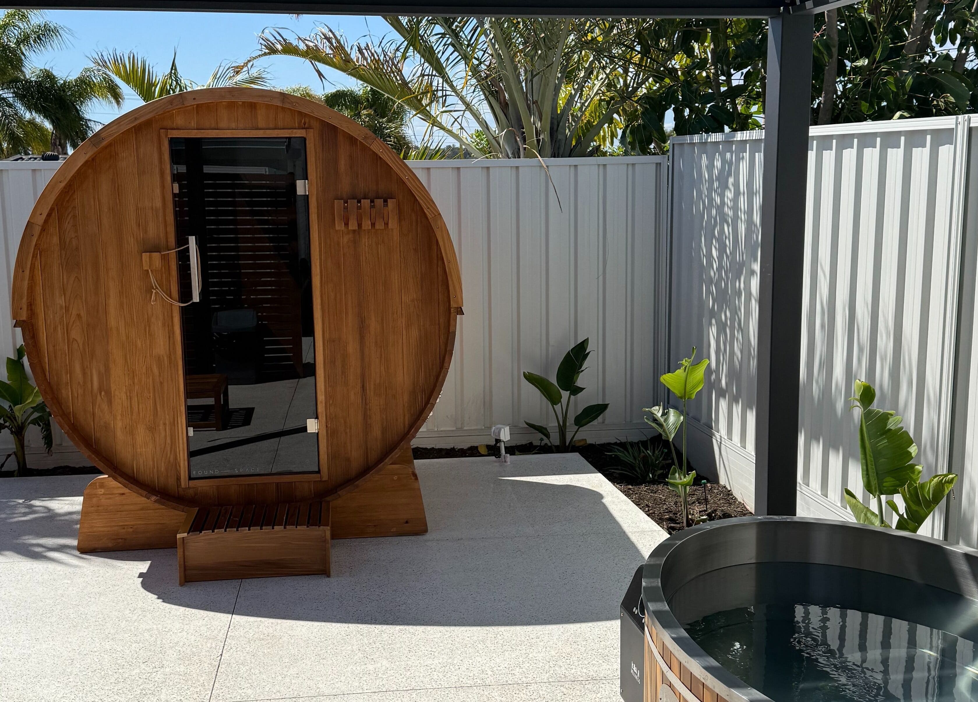 Outdoor sauna and tub at Rise and Fall Wellness, Kallaroo, Western Australia, AU.