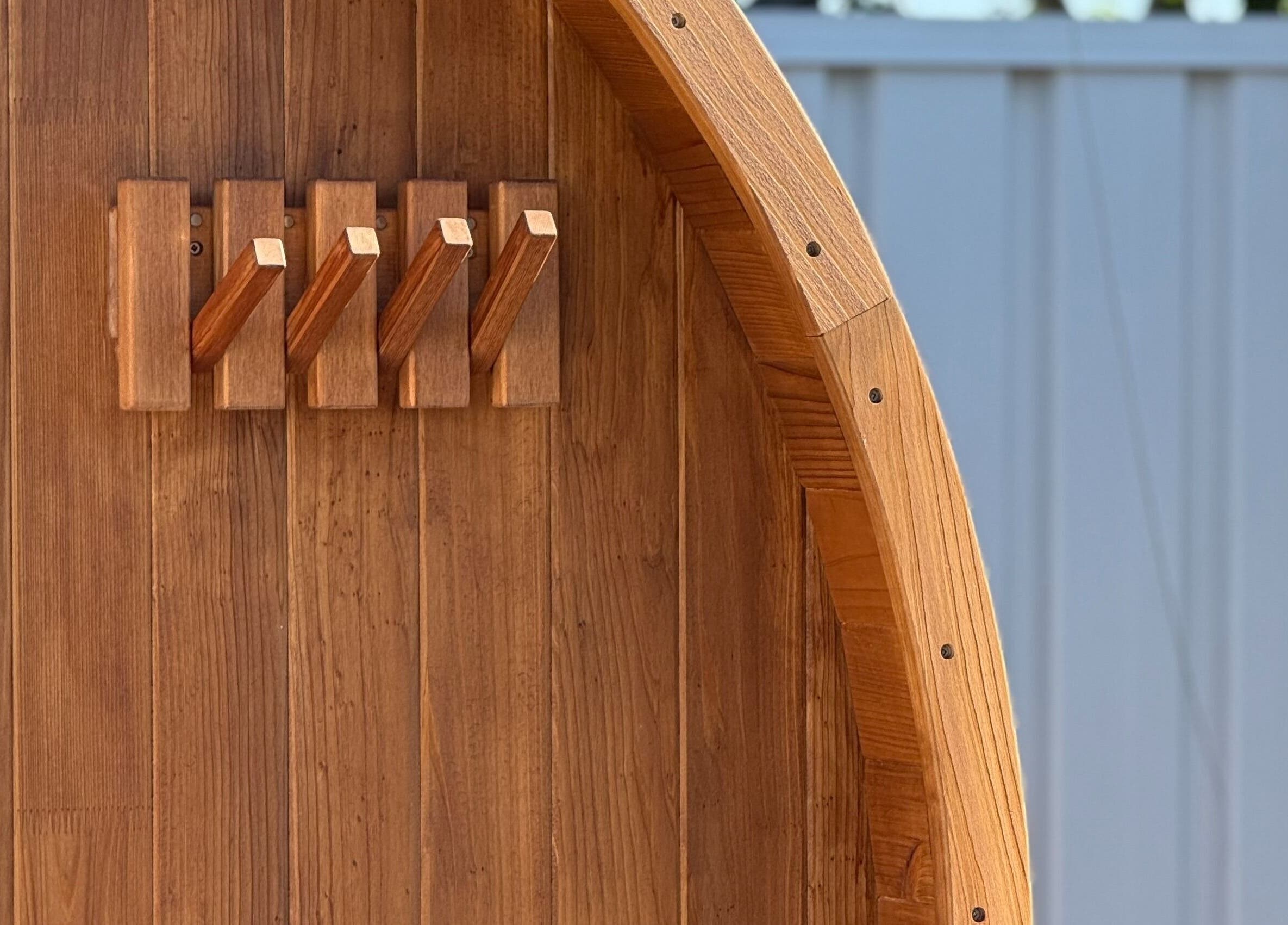Wooden sauna entrance at Rise and Fall Wellness in Kallaroo, Western Australia, AU, showcasing wellness design.