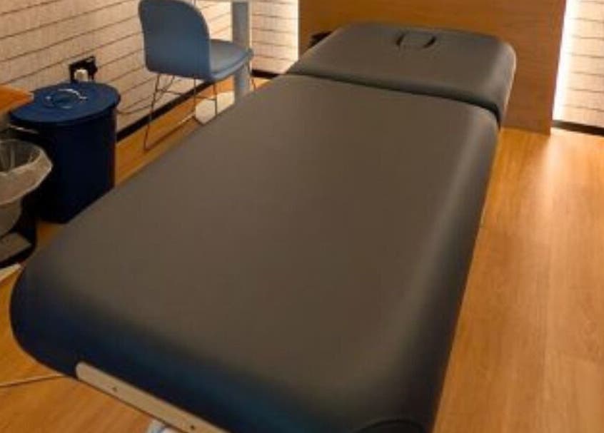 Therapy bed in cozy Working Space, SG, offering relaxing treatments in a peaceful environment.