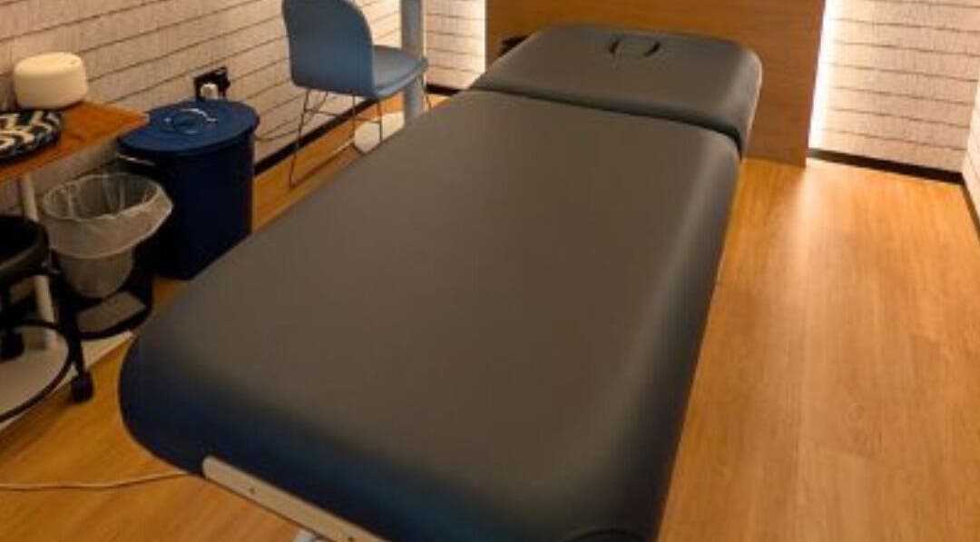 Therapy bed in cozy Working Space, SG, offering relaxing treatments in a peaceful environment.
