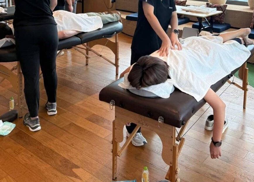 Professional massage therapy in progress at Working Space, SG, offering a tranquil wellness experience.