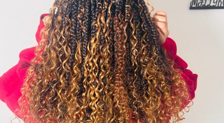 Golden brown curly hairstyle showcased at Millyk Beauty, Burlington, Massachusetts, US.