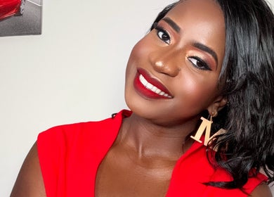 Woman in red dress with elegant makeup at Millyk Beauty, Burlington, Massachusetts, US.