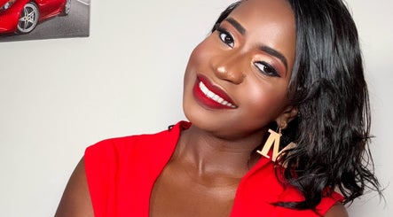 Woman in red dress with elegant makeup at Millyk Beauty, Burlington, Massachusetts, US.