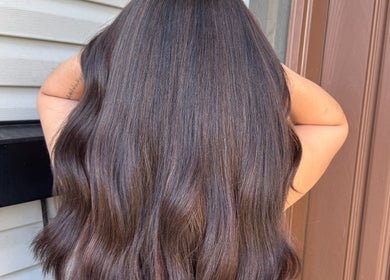 Luxurious long brunette hair styled at Simschair, Surrey, British Columbia, CA, showcasing expert treatment.