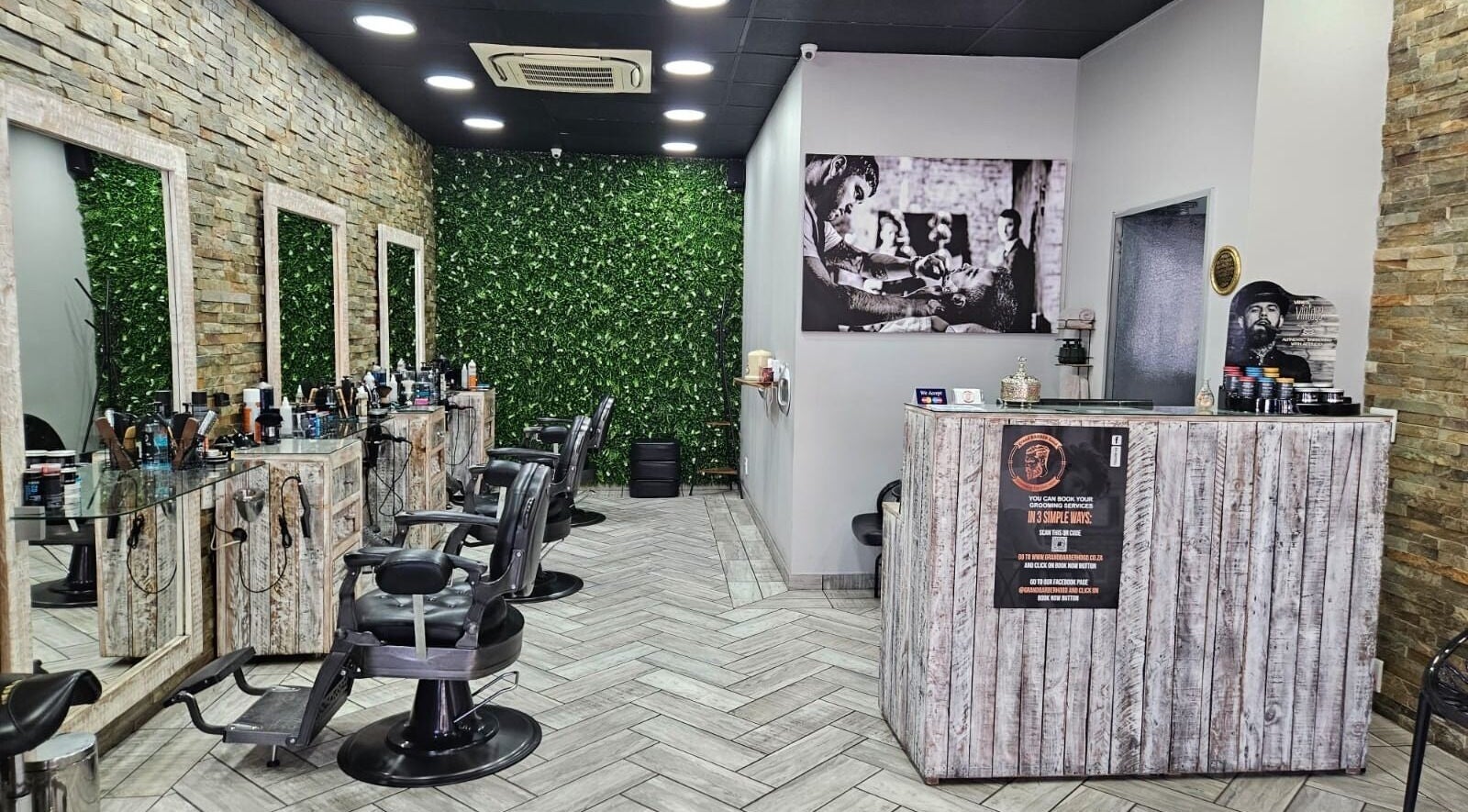 Interior of Grand Barberhood at Rivonia Village, Sandton, Gauteng, ZA featuring stylish chairs and rustic decor.