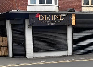 Street view of Divine Aesthetics & Beauty storefront in Crewe, England, GB with elegant signage.