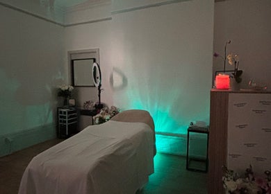Tranquil treatment room at Face it with glow, Southampton, England, GB, featuring a massage table and ambient lighting.