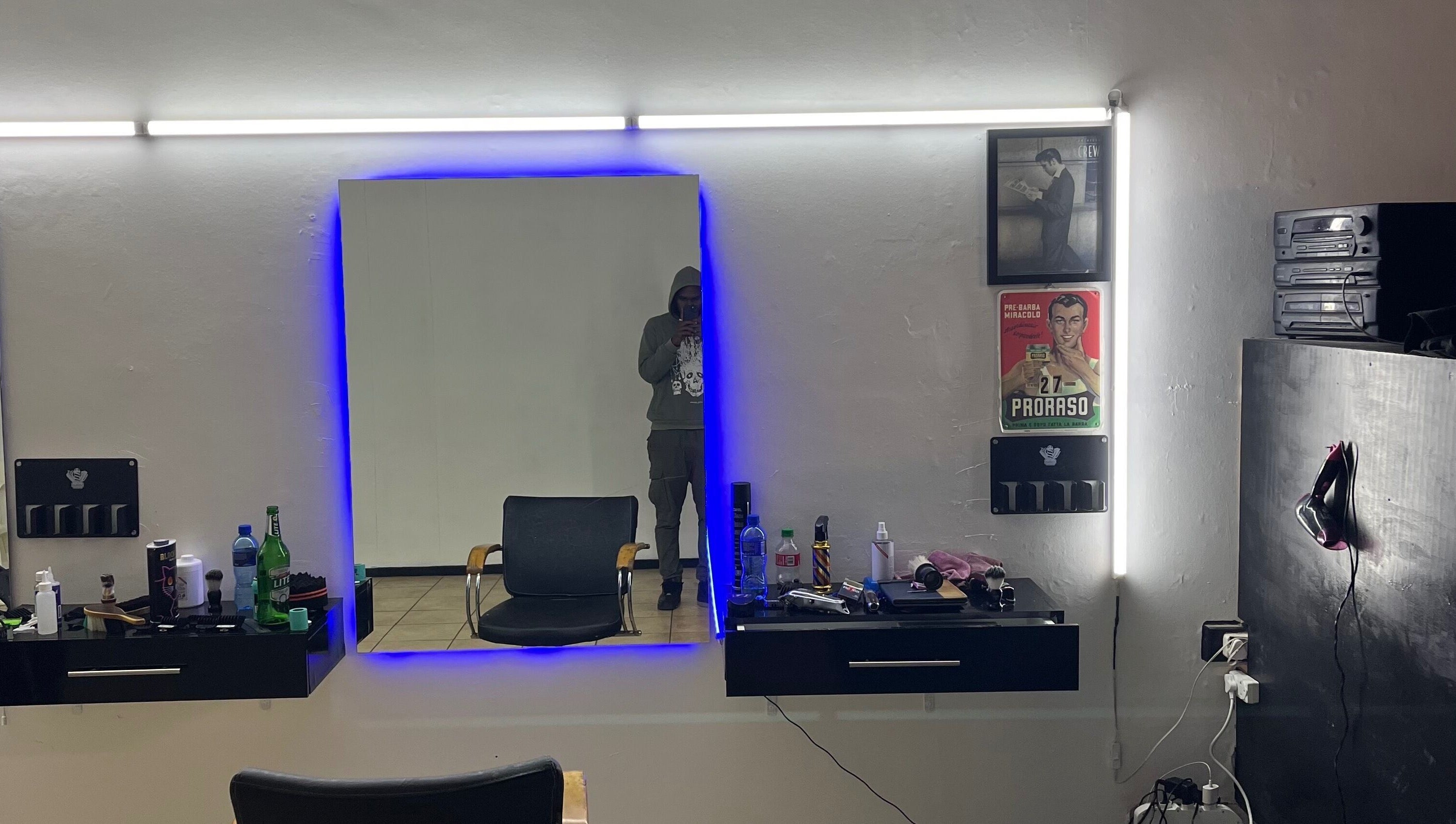 Darthfader031 salon interior in Roodepoort, Gauteng, ZA featuring a modern mirror and styling station.