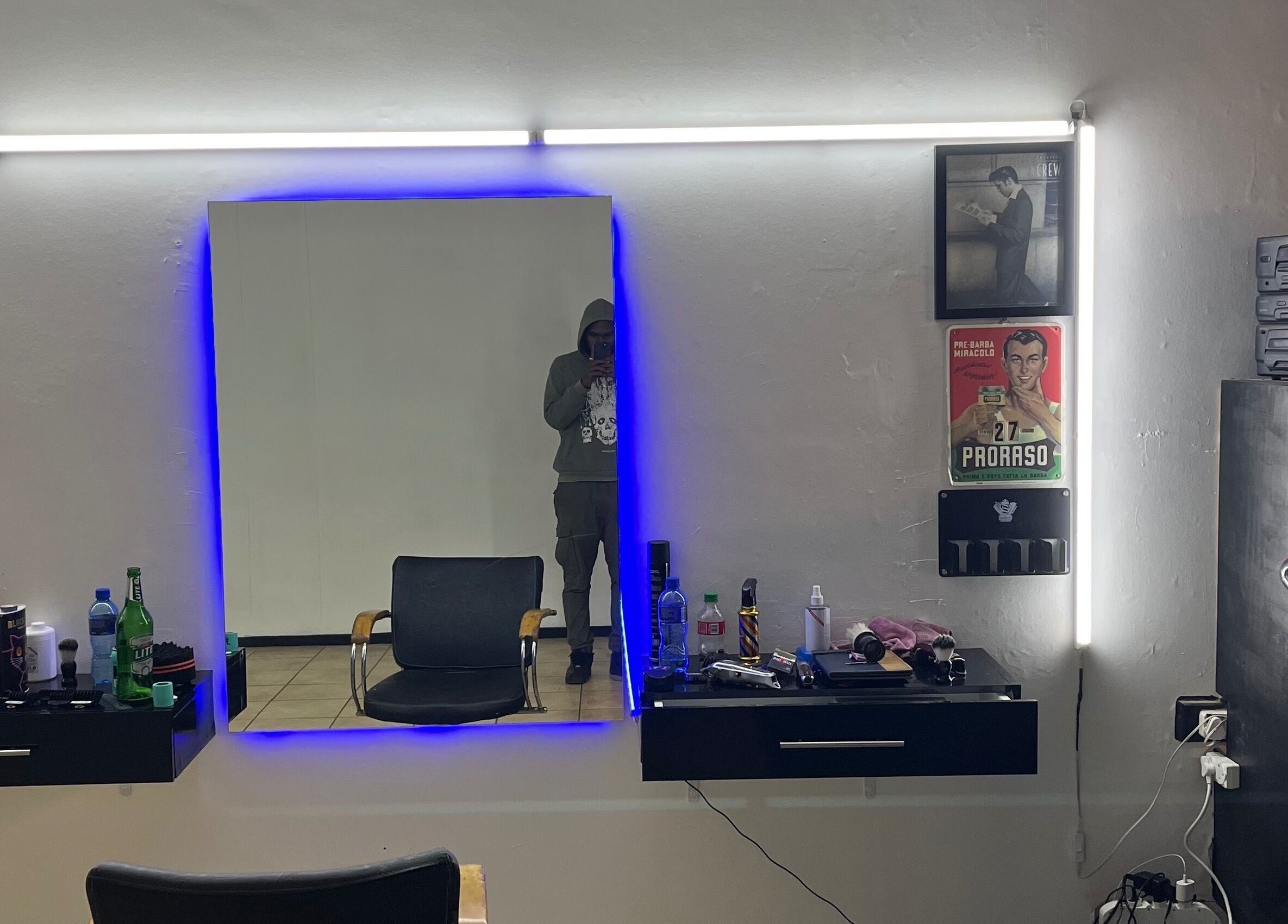 Darthfader031 salon interior in Roodepoort, Gauteng, ZA featuring a modern mirror and styling station.