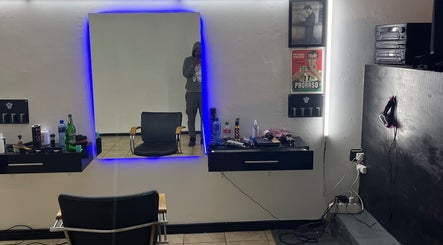 Modern styling station at Darthfader031, Roodepoort, Gauteng, ZA, featuring sleek mirror and barber tools.