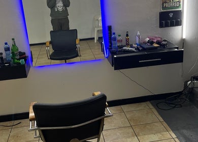Modern grooming station at Darthfader031, Roodepoort, Gauteng, ZA with sleek chairs and illuminated mirror.