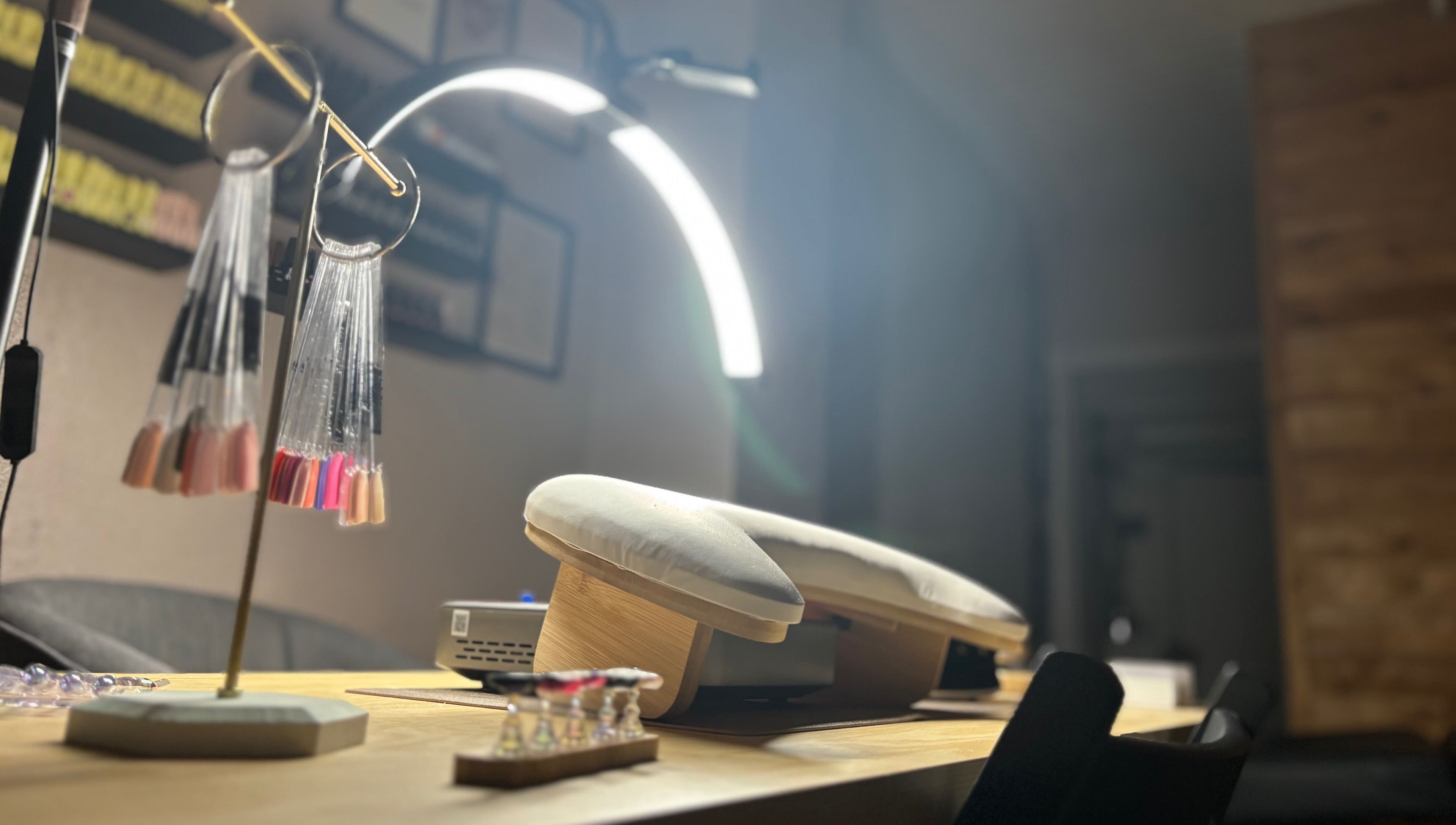 Elegant nail station at Ruled by Venus Nail Co., Port Seton, Scotland, GB, showcasing modern manicure tools.