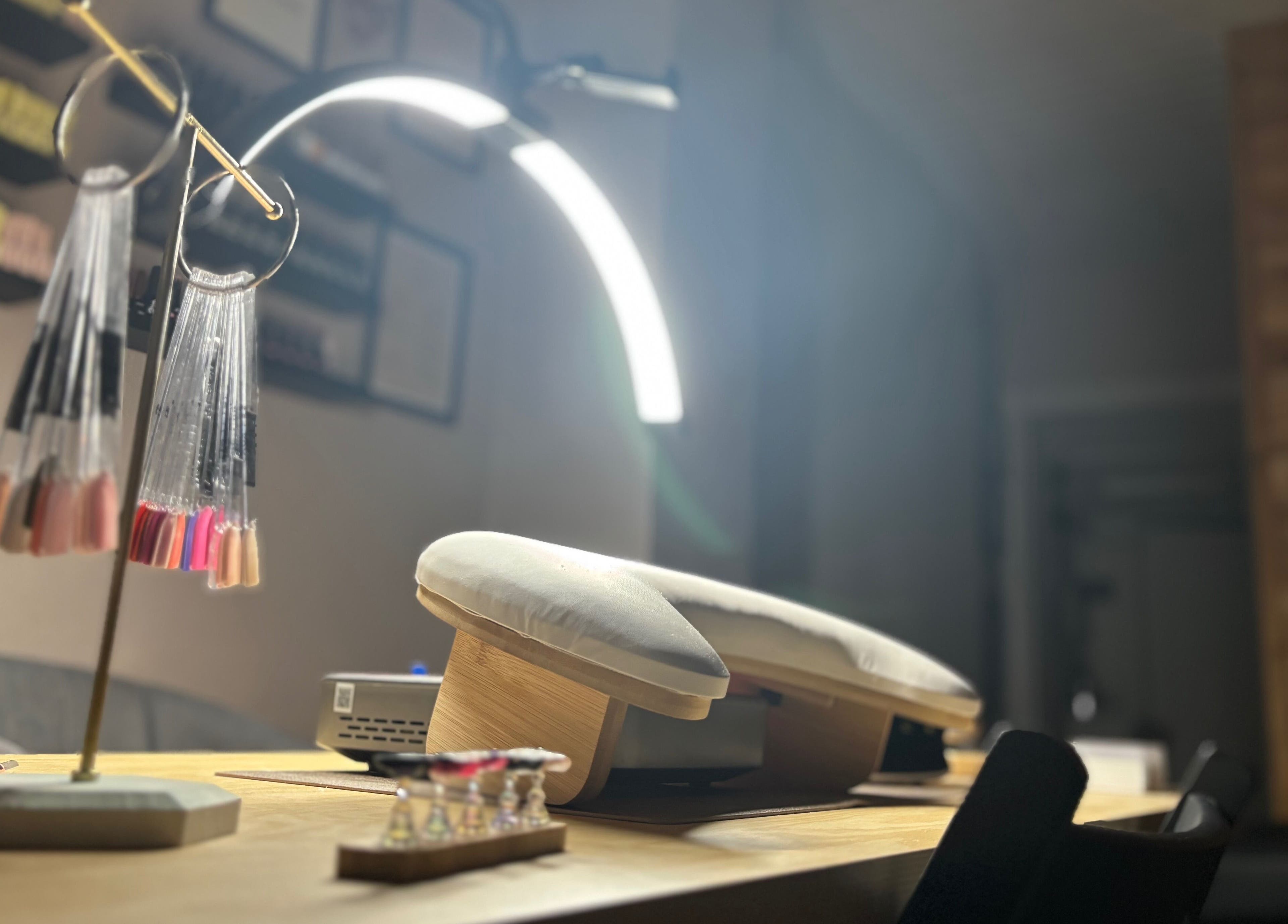 Elegant nail station at Ruled by Venus Nail Co., Port Seton, Scotland, GB, showcasing modern manicure tools.