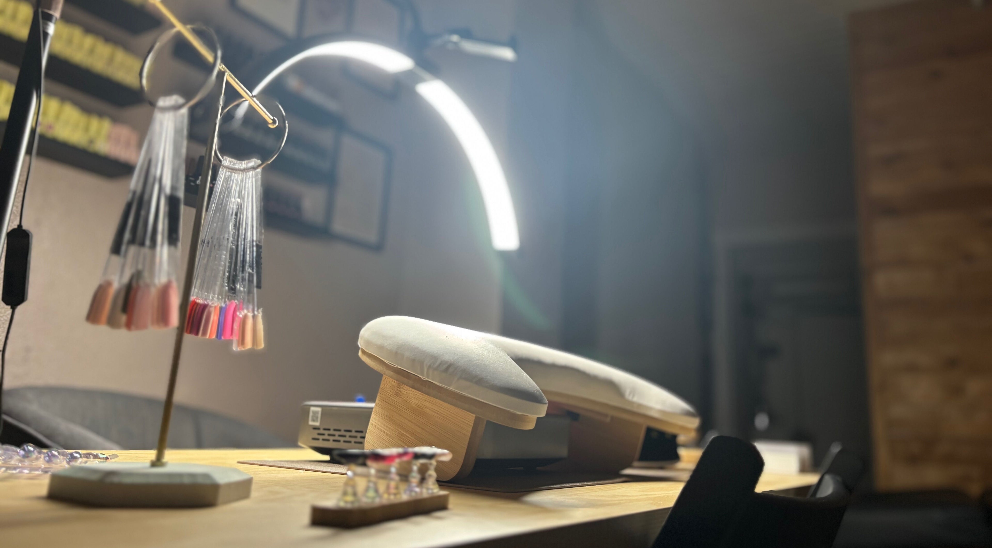 Elegant nail station at Ruled by Venus Nail Co., Port Seton, Scotland, GB, showcasing modern manicure tools.