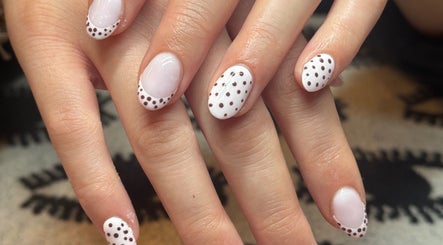 Elegant polka-dot nail art at Nella Beauty, Oldbury, England, GB. Perfect for modern style.
