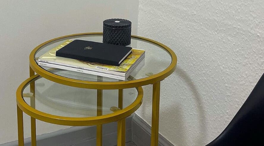 Stylish side tables with decor at Leia Beth Lash & Brow Technician, Dundee, Scotland, GB.