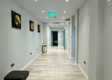 Elegant hallway at Na Siam Spa, London, England, GB with serene lighting and decor.