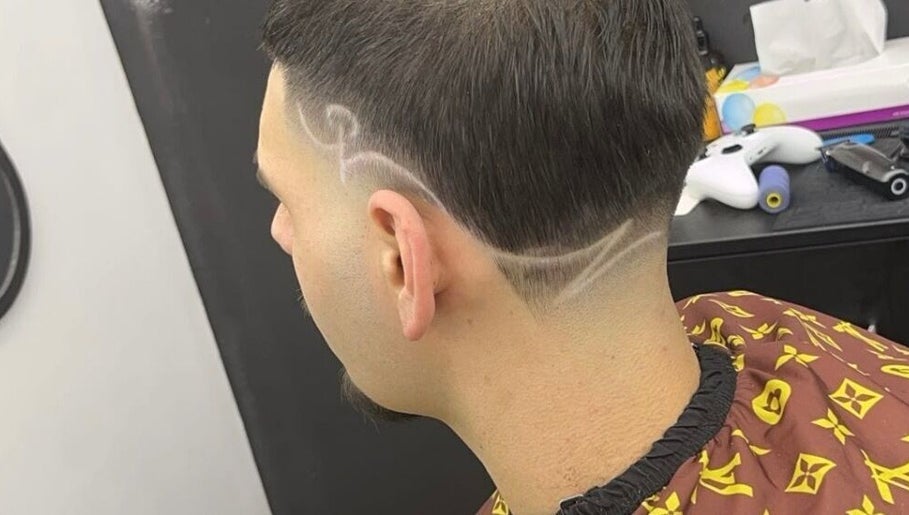 Stylish hair design at King of Fades in Royston, England, GB, showcasing intricate fade line patterns.