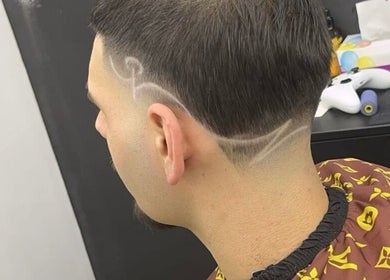Stylish hair design at King of Fades in Royston, England, GB, showcasing intricate fade line patterns.