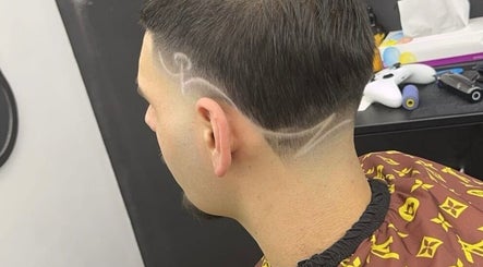Stylish hair design at King of Fades in Royston, England, GB, showcasing intricate fade line patterns.