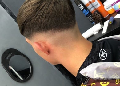 Close-up of a precision haircut at King of Fades, Royston, England, GB showcasing a sleek fade style.