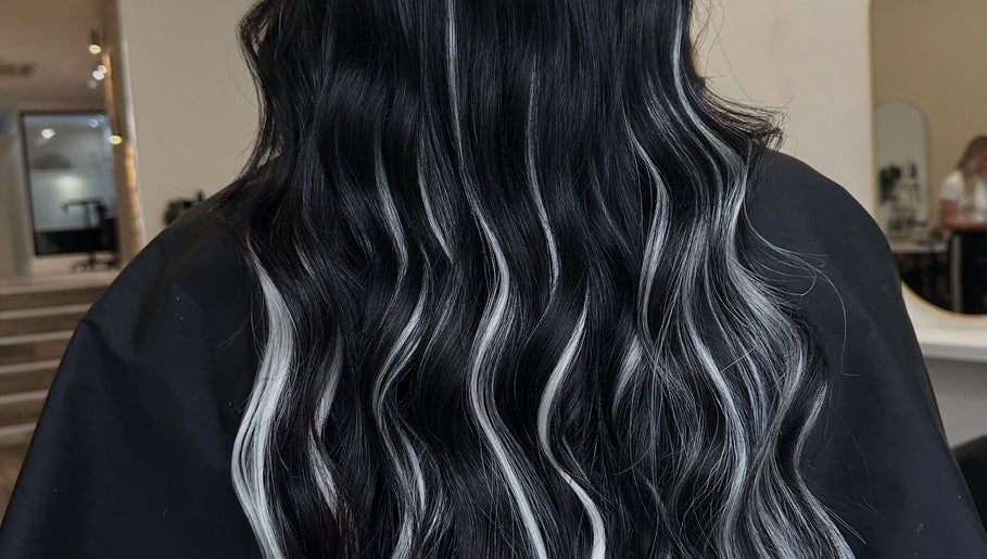 Sleek black and white waves hairstyle at Mirren Wordie Hair, Stirling, GB. Modern salon style.