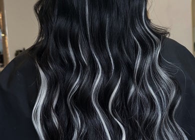 Sleek black and white waves hairstyle at Mirren Wordie Hair, Stirling, GB. Modern salon style.