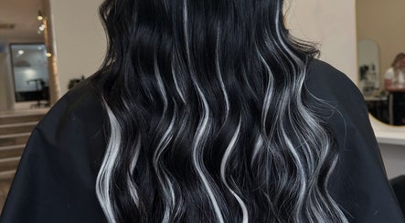 Sleek black and white waves hairstyle at Mirren Wordie Hair, Stirling, GB. Modern salon style.