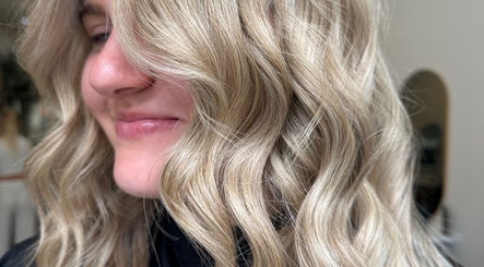 Soft golden waves hairstyle at Mirren Wordie Hair, Stirling, GB. Captures elegance and style by expert stylists.