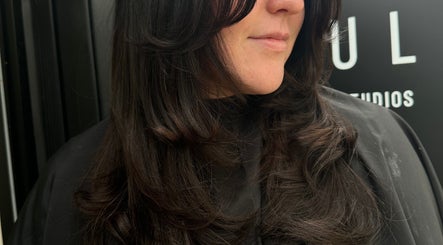 Elegant brunette waves styled at Mirren Wordie Hair, Stirling, Scotland, GB. Perfect for a chic, modern look.